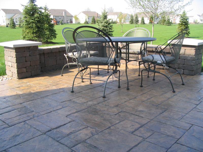 Brussels Dimensional Stone walls paired with grand ashler slate stamped concrete